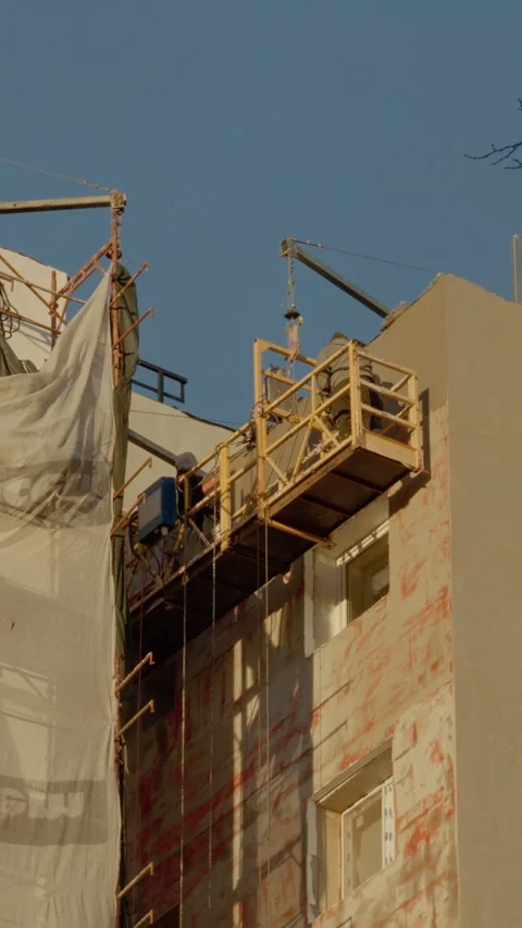 Vertical Screen Insulation work in progress on an apartment building site Stock Footage 303505146