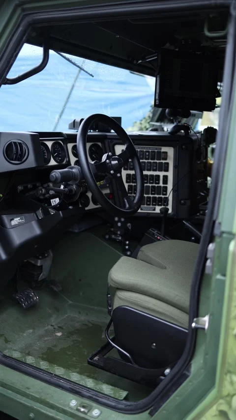 Vertical screen interior of advanced military vehicle shows control panel steeri Stock Footage 311149835