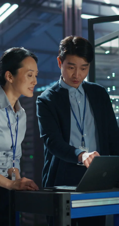 Vertical Screen IT Specialists Working in Data Center Stock Footage 320001663