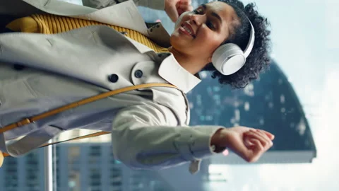 Vertical Screen Latin Female Dancing Lisening Music on Elevator Stock Footage 167556643