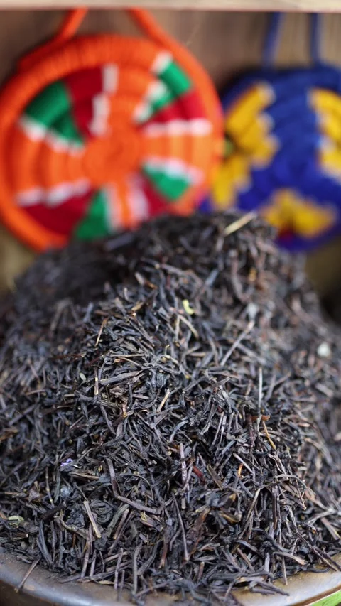 Vertical screen loose black tea close up rich texture natural herbs aromatic spi Stock Footage 310012109