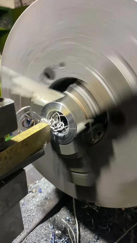 Vertical screen: Machining shaft on lathe. metalworking. Turner working on Stock Footage 263126446