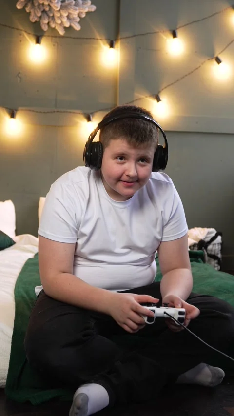 Vertical screen: Man gamer hands holding modern console for play station close Stock Footage 263126264