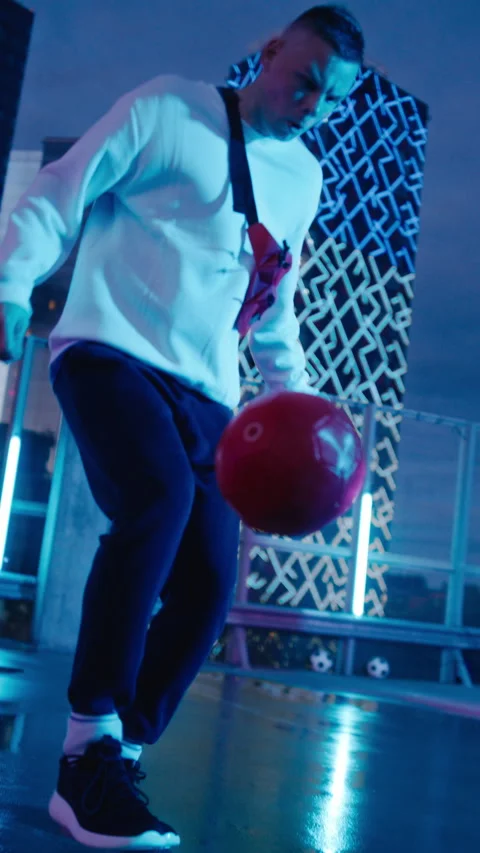 Vertical Screen Man Playing Soccer at Night Stock Footage 229851476