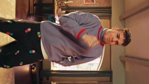 Vertical Screen Man Recording Dancing Video on Smartphone at Home Stock Footage 171938482