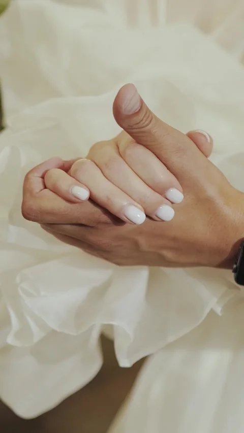 Vertical screen: married couple holding hands. Close-up of hands, bride and Stock Footage 307766892