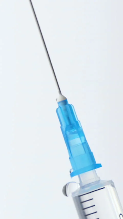 Vertical Screen: Medication drug needle syringe drug,medical concept flu shot Stock Footage 232265050