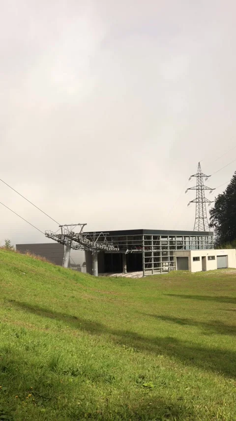 Vertical screen modern cable car station with metal construction and power line  Stock Footage 318219930