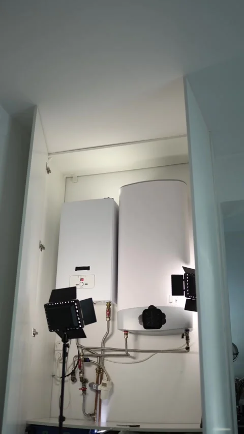 Vertical screen modern heating boiler and large water tank with metal pipes and  Stock Footage 318867739