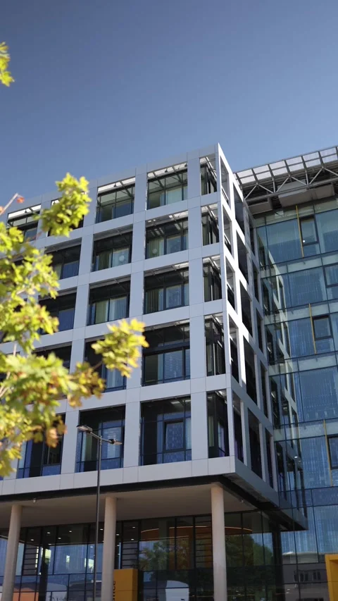 Vertical screen modern office building with glass facade and geometric design un 스톡 동영상 312287239
