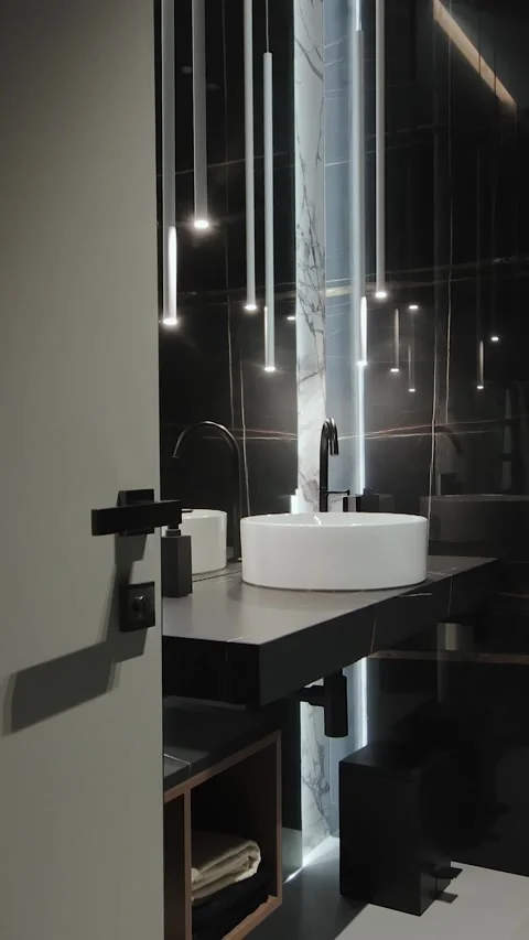 Vertical screen: The modern round bathroom sink with black faucet has an Stock Footage 311255291