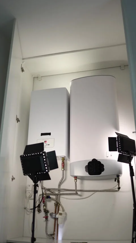 Vertical screen modern water heater and heating boiler with metal pipes and valv Stock Footage 318867731