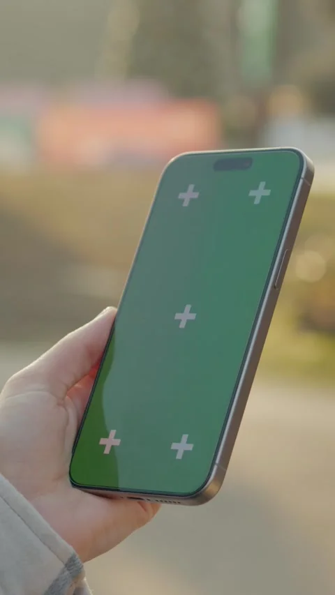 Vertical Screen Mother using green screen smartphone next to baby stroller Stock Footage 303564141