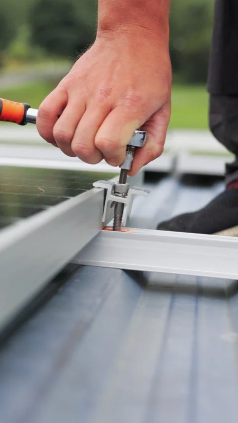 Vertical Screen: Mounting solar panel, installing solar panels on the roof of Stock Footage 272170869