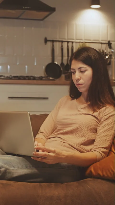 Vertical screen: Multitasking Mom Balancing Work and Children Stock Footage 274587147