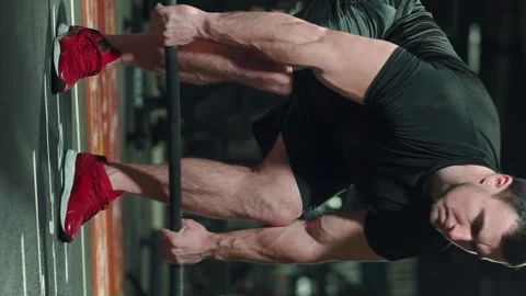 Vertical Screen: Muscular man working out with barbell in gym Stock Footage 244933702