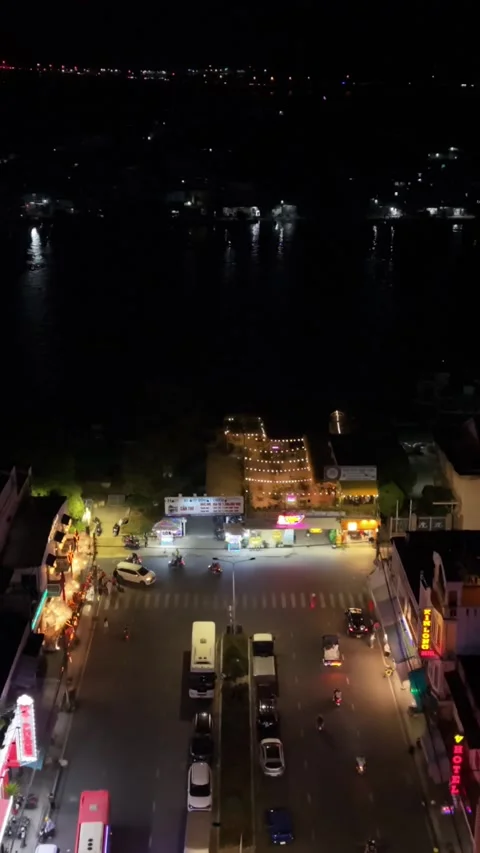 Vertical screen Nighttime Urban Environment Showcasing Lively Intersections And Stock Footage 336047201
