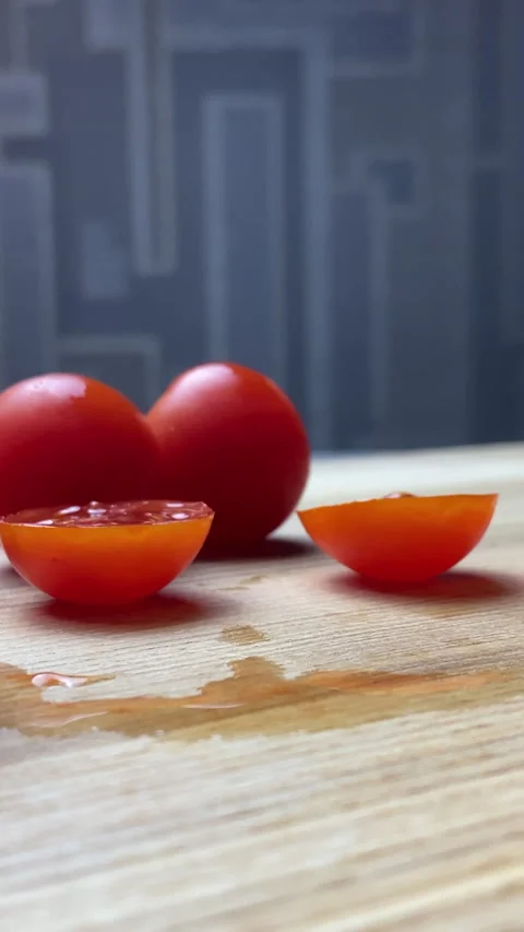 Vertical screen: Overall, "Knife Cutting Red Tomato" is a mouth-watering video Stock Footage 238700586