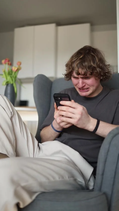 Vertical screen: The person appears to be crying, showing distress and emotional Stock Footage 302632699