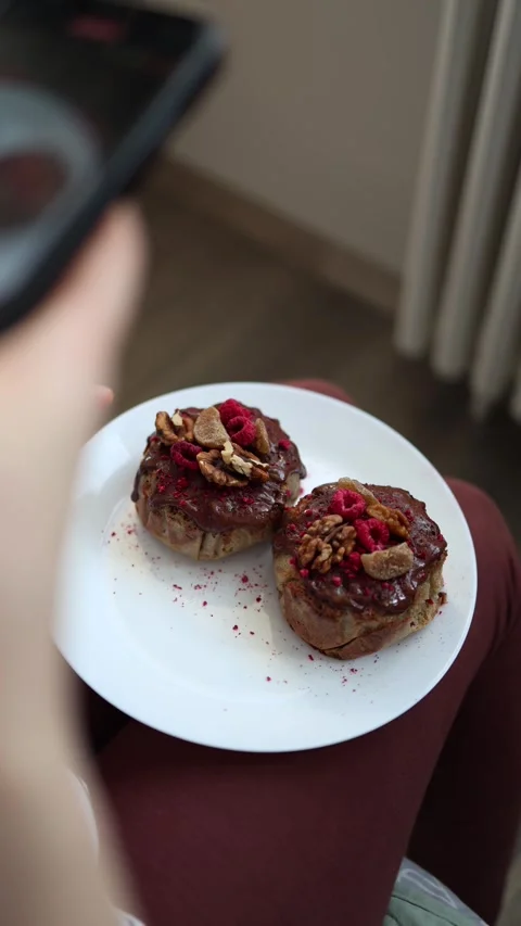 Vertical screen: Person recording a video of homemade Easter pastries on a smart Stock Footage 305295272
