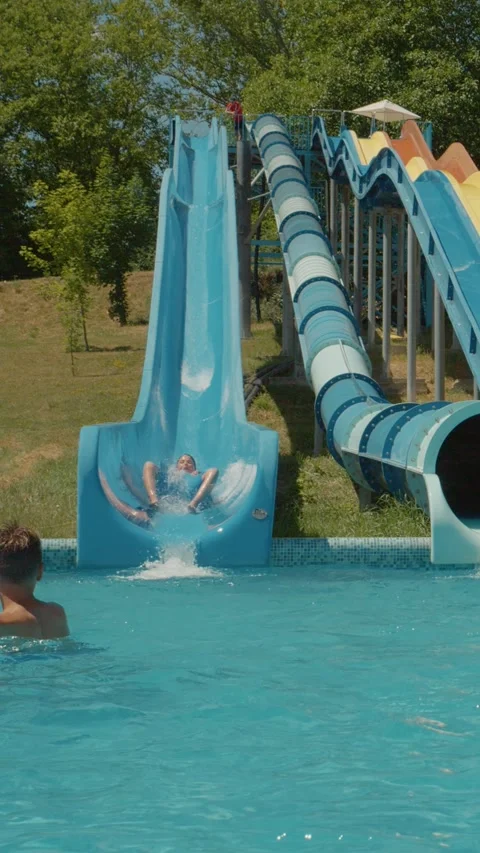 Vertical Screen Playground for children on summer holiday at a Aqua Park. Stock Footage 300011728