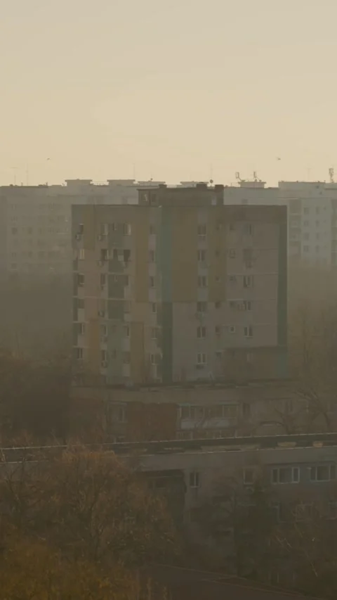 Vertical Screen Pollution blankets residential blocks in foggy urban landscape Stock Footage 303505247