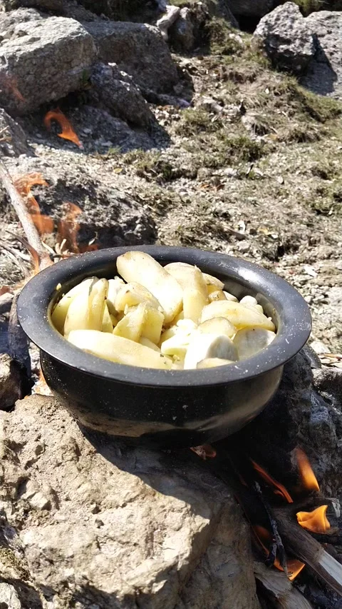 Vertical screen, potato cooking on fire Video stock 154757843