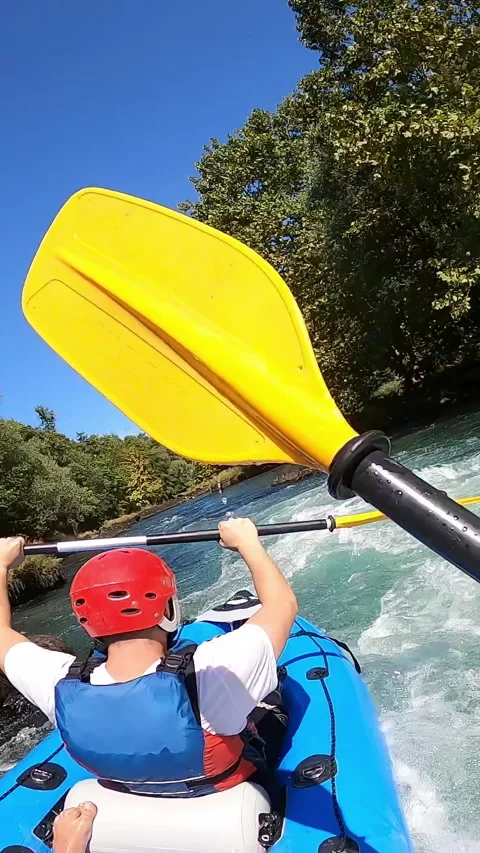 Vertical Screen: POV of Two Men Whitewater Paddling a Tandem Kayak Down a River Stock Footage 280380809