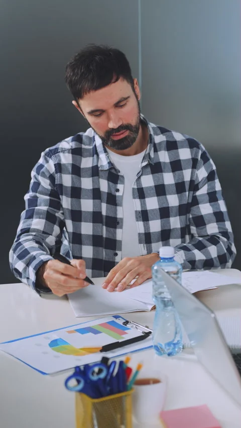 Vertical screen: Professional Reviewing Documents During Office Meeting Stock Footage 279153451