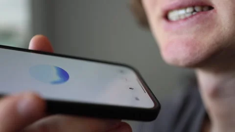 Vertical screen real-time ChatGPT voice input close-up young man speaking confid Stock Footage 305999345