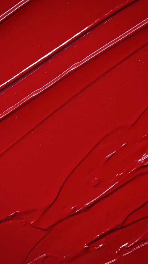 Vertical Screen: Rich Red Lipstick Swirled In Glossy, Elegant Texture Stock Footage 311023931
