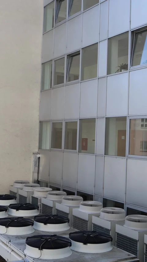 Vertical screen rooftop cooling system with multiple industrial fans and air con Stock Footage 314519067