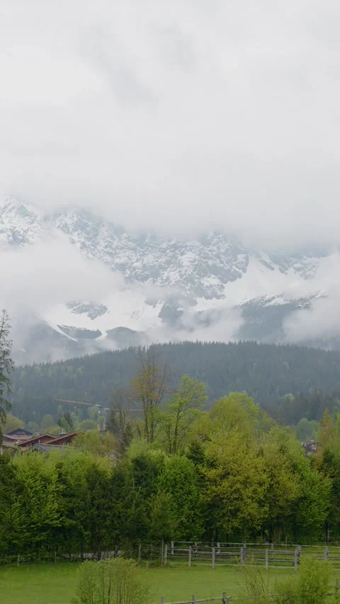 Vertical Screen Serene large view of the mountains covered in fog in the morning Stock Footage 303443032