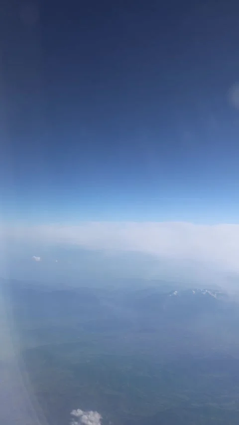 Vertical screen serene sky above mountain range with soft morning haze peaceful  Stock Footage 310470877