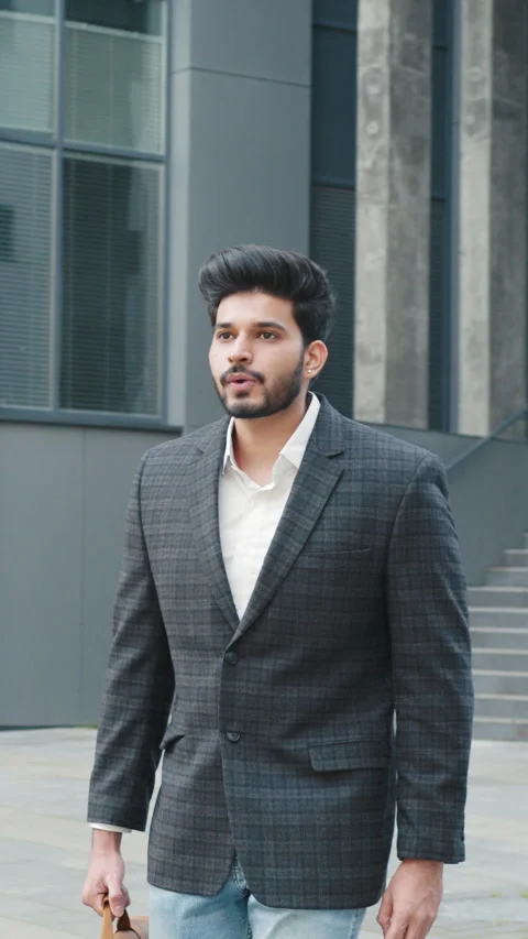 Vertical Screen: Shot of moving around businessman stand on street in downtown Stock Footage 272661535