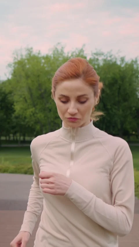 Vertical Screen Side view of jogging motivated woman Video stock 299849718