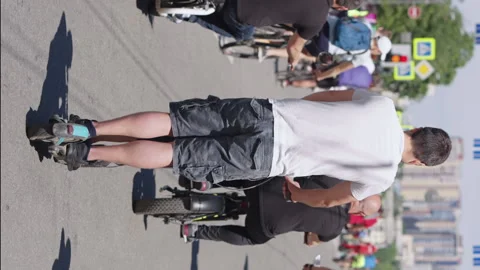 Vertical Screen: Slow motion people riding electric scooters Stock Footage 223665246