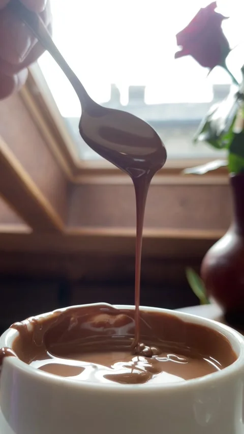Vertical screen: Slow motion shot pouring melted chocolate, close-up seamless Stock Footage 263129841