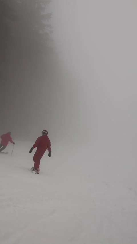 Vertical screen snowboard turn in fog Stock Footage 327092252