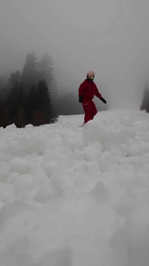 Vertical screen snowboarder rides rough broken slope Stock Footage 327092250