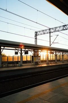 Vertical screen: soft dawn illumination filtering through architectural train Stock Photos