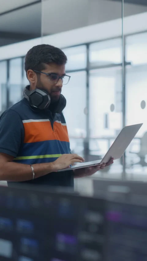 Vertical Screen Software Developer Using Laptop Computer in Office Stock Footage 296185097