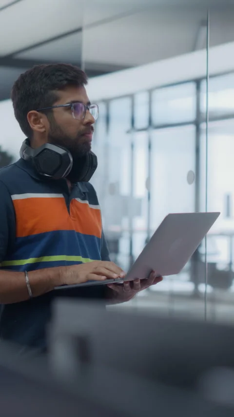 Vertical Screen Software Developer Using Laptop Computer in Office Stock Footage 296185111