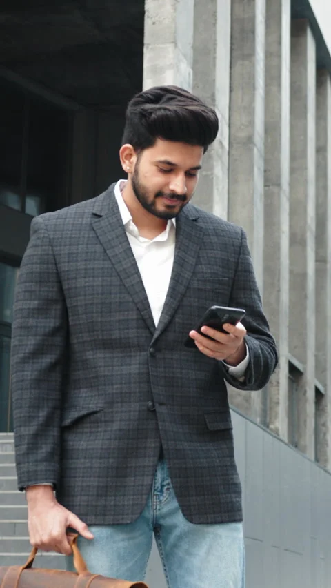 Vertical Screen: Stylish arabian man in business clothes standing near office Stock Footage 272673464