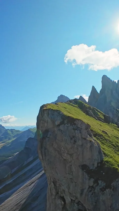 Vertical Screen Sunlit Jagged Peaks With Cloud And Lensflare, Dramatic Serrated Video stock 325059656