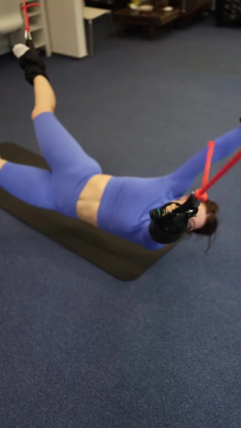 Vertical screen suspension training core workout strong female athlete in purple Stock Footage 306540763