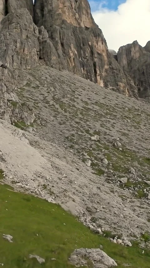 Vertical screen Tall precipices overlooking slopes covered with scattered rocky Stockbeeldmateriaal 323778105