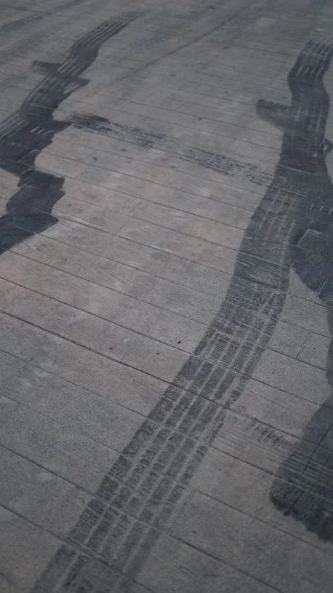 Vertical screen tire marks on road Stock Footage 331199644