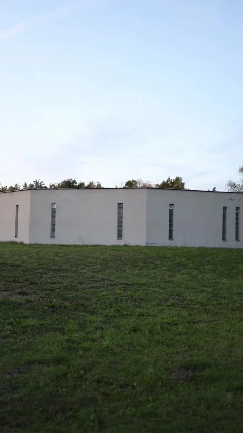 Vertical screen top part of concrete bunker with narrow rectangular windows unde 스톡 동영상 319832778