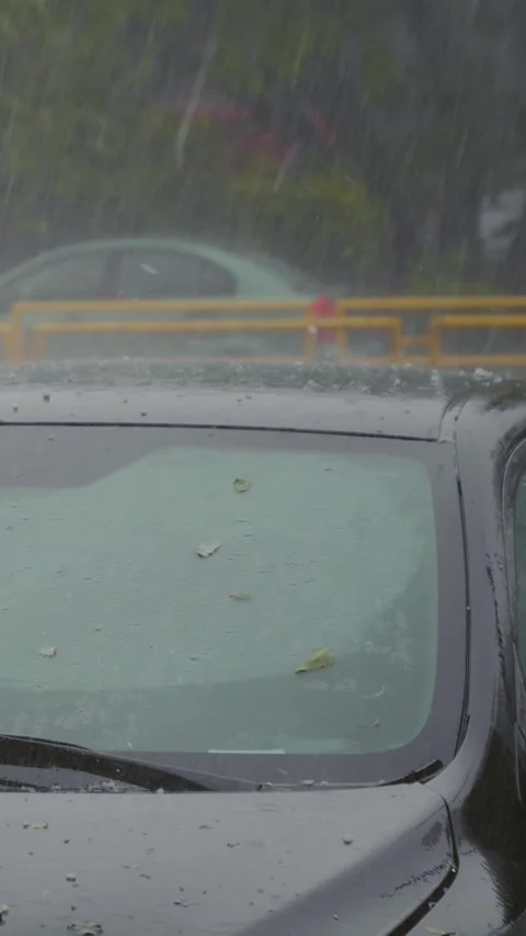 Vertical Screen Torrential rain and hail falling on the roof of the car. Stock Footage 299847732